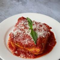 Lasagna alla Bolognes · Homemade classic lasagna with layers of lasagna sheets alternated with our signature Bologne...
