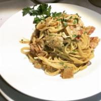 Spaghetti alla Carbonara · Onion, pancetta and egg.