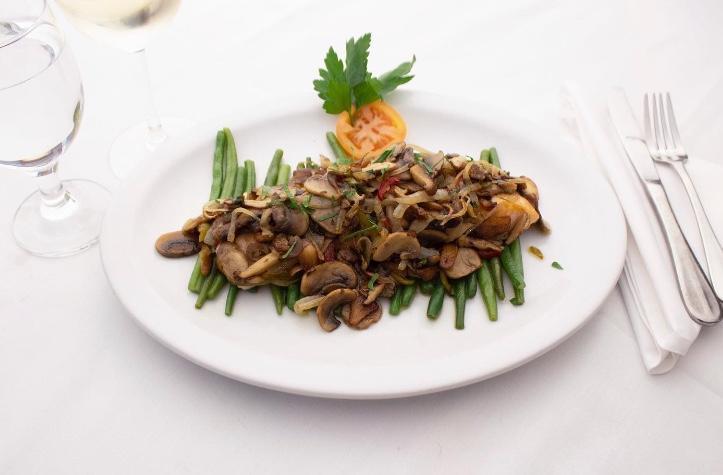 Salmone alla Griglia con Funghi · Grilled salmon with sauteed garlic, onions, mixed mushrooms and cherry peppers on top. Served over steamed beans.