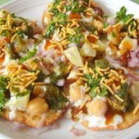 Aloo Papri Chat · Flour crispies topped with potatoes. Chickpea, flour straws and mint, yogurt and tamarind sa...
