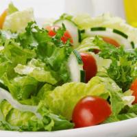 Green Salad · Green salad: garden greens, tomatoes and cucumber.