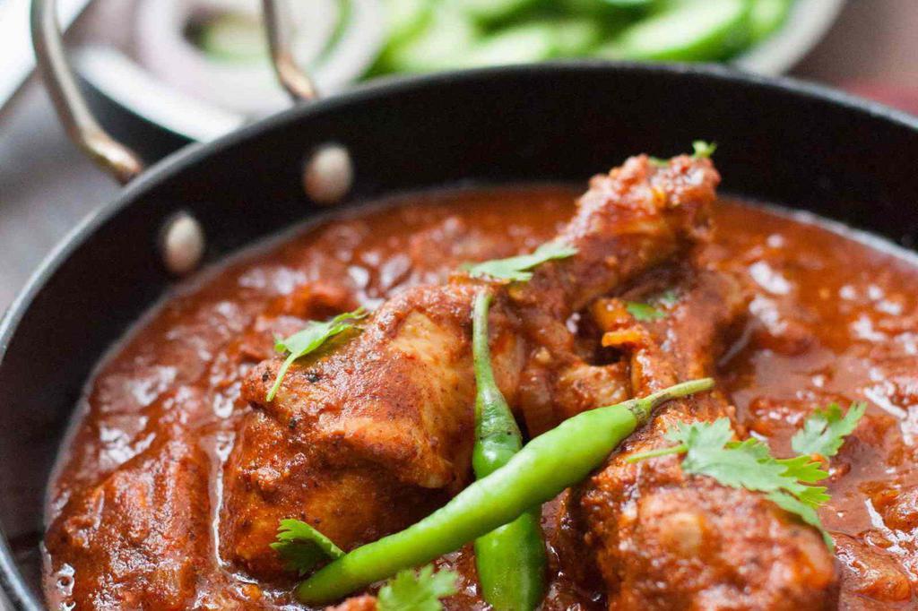 Chicken Vindaloo · Boneless cubes of chicken prepared with red chilies, hot spices and vinegar. Very spicy.