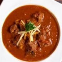 Lamb Vindaloo · Boneless cubes of lamb prepared with red chilies, hot spices and vinegar. Very spicy.