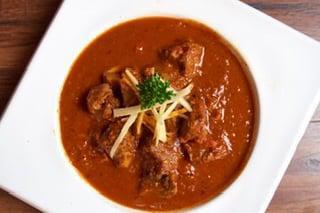 Lamb Vindaloo · Boneless cubes of lamb prepared with red chilies, hot spices and vinegar. Very spicy.