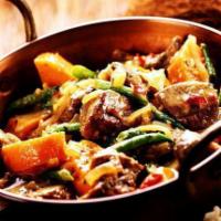 Lamb Balti · Boneless cubes of lamb cooked with onion, tomato, bell pepper, green peas, broccoli and arom...
