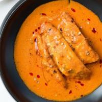 Goan Fish Curry · Let of salmon marinated in tamarind and simmered in a delicately spiced gravy.
