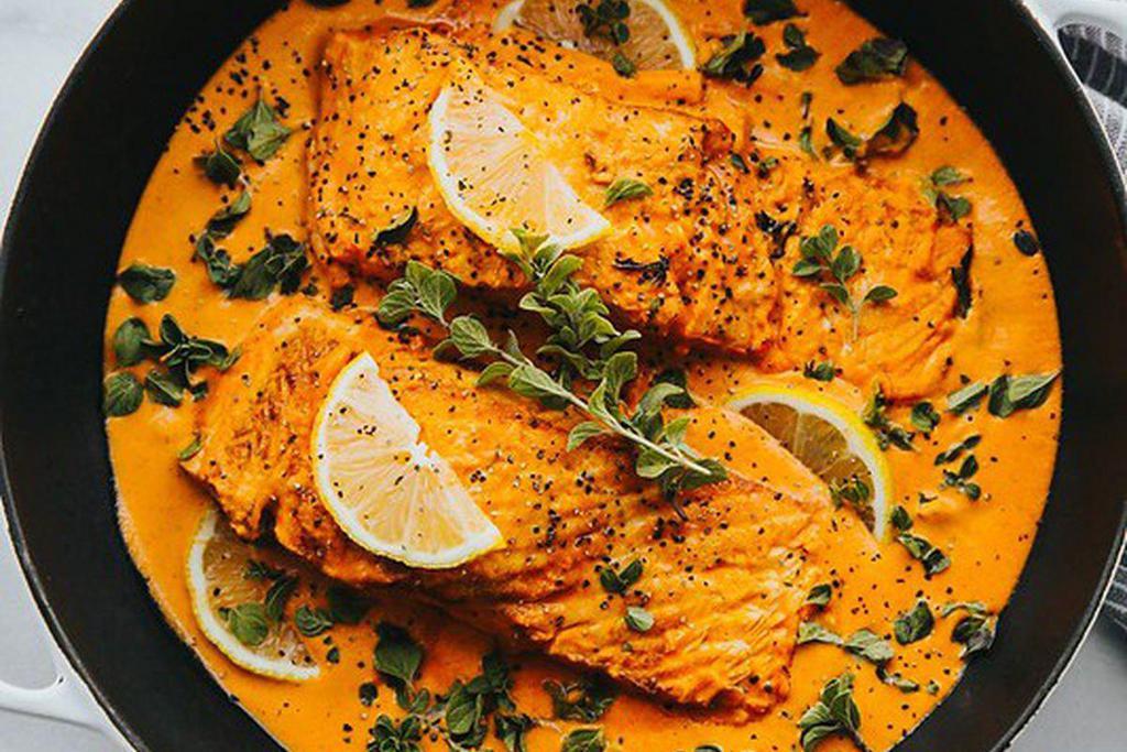 Fish Tikka Masala · Cubes of salmon cooked in tandoor and finished in a mild tomato sauce.