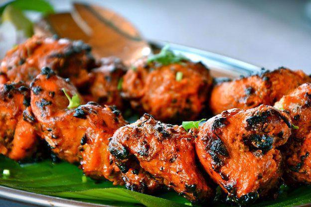 Chicken Tikka Kebab · Cubes of chicken breast marinated in ginger garlic and herbs slowly cooked on skewers in tandoor.