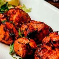 Achari Chicken Tikka Kebab · Boneless pieces of chicken breast marinated in ginger, garlic, herbs and Indian pickle (acha...