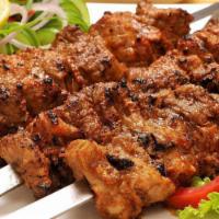 Lamb Boti Kebab · Boneless chunks of lamb marinated in herbs and spices, cooked on skewers in tandoor, moist, ...