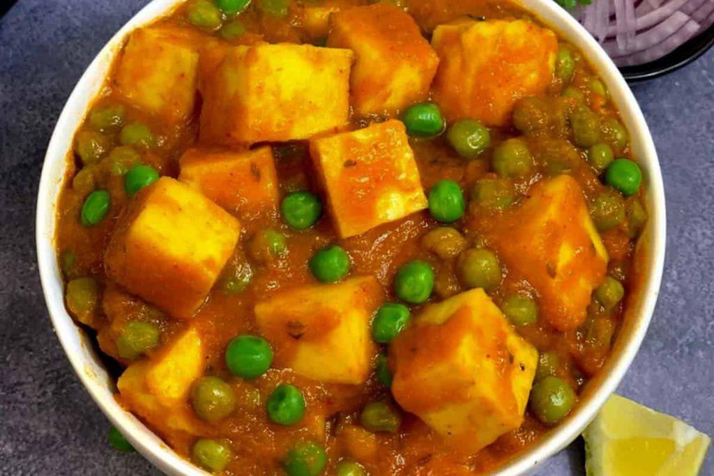 Mutter Panner · Green peas and homemade cubes of cheese cooked in a thick rich sauce.