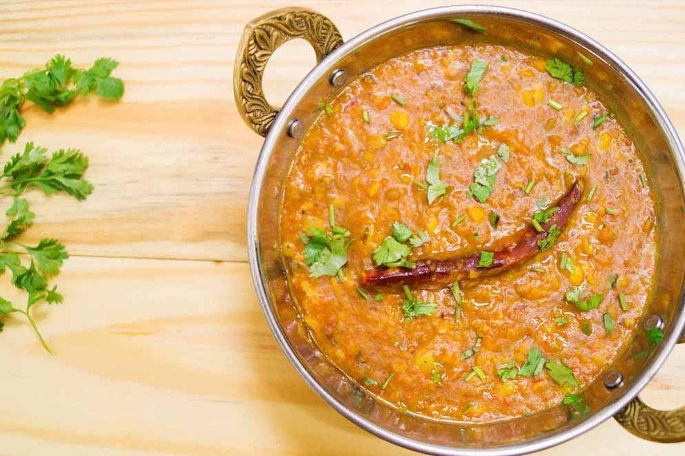 Tharka Daal · Yellow lentils cooked with ginger, onions, tomatoes and cumin. 