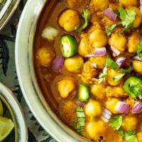 Chaana Masala · Chickpeas cooked with onion and tomatoes.