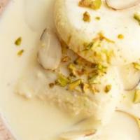 Rasmalai · Spongy Home Made Cheese Patties Simmered In Milk Flavored With Rose Water