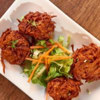 Pakoras  · Crispy fritters in chickpea flour batter - choice of onion, cauliflower or spinach.