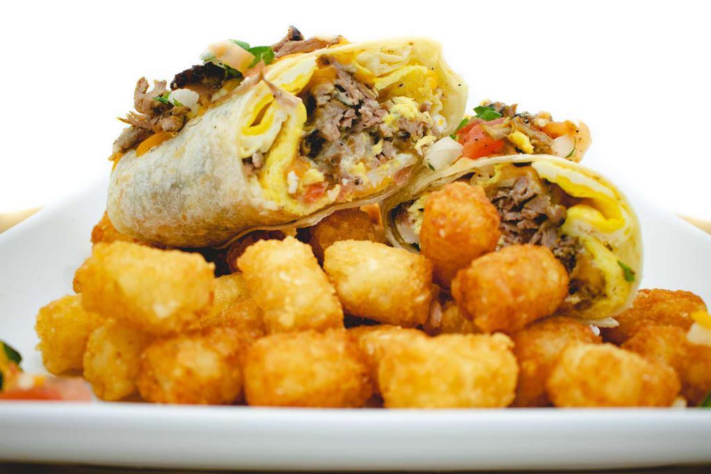 Carne Asada Burrito · Large tortilla filled with carne asada beef, mixed cheese, pico de gallo and sour cream. Avocado is available for an extra charge. Served with a side of crispy tater tots.