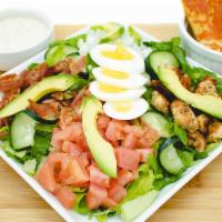 Cobb Salad · Tender grilled chicken, hard-boiled egg, crispy bacon, tomato, avocado, onions, bleu cheese,...