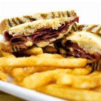 Reuben Sandwich · Served on toasted rye bread with 6 oz. of corned beef, sauerkraut, Thousand Island dressing ...