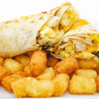 Veggie Burrito · Grilled fresh mushrooms, 2 eggs, tomato, onion, spinach and Swiss cheese wrapped in a 12