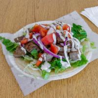 Lamb Gyro Salad · Salad with thin slices of roasted meat. Cooked on a spit and wrapped in a pita. 