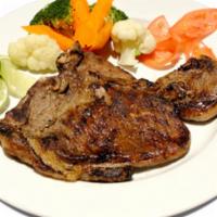 Grilled Steak · Served with rice and beans or moro or tostones and a green salad
