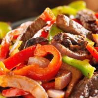 Pepper Steak · Served with rice and beans or moro or tostones and a green salad.