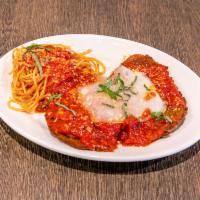 Eggplant Parmesan · breaded crispy eggplant topped with tomato sauce and mozzarella with a side of pasta.