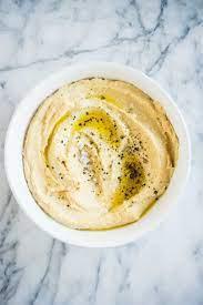 Hummus  · Chickpeas, tahini, garlic and olive oil.