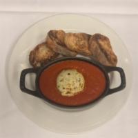 Baked Goat Cheese · Tomato sauce and toasted baguette.