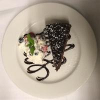 Flourless Chocolate Cake  · Whipped cream and fresh berries. GLUTEN FREE