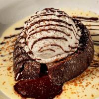 Warm Chocolate Cake  · Molten chocolate cake, anglaise, vanilla bean gelato
