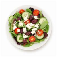 Greek Salad · Crisp lettuce, feta cheese, stuffed grape leaves, tomato, olives and onion.