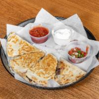 Buffalo Chicken Quesadilla · Grilled or fried chicken, jack or cheddar shredded cheese, blue cheese, crumbles, Buffalo an...