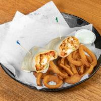 Buffalo Tender Wrap · Crispy strips of breaded chicken tossed in spicy Buffalo sauce in a wrap with lettuce, tomat...