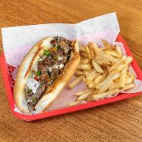 Philly Cheese Steak · A classic with beef or chicken, green peppers, onions, mushrooms, and melted provolone cheese.