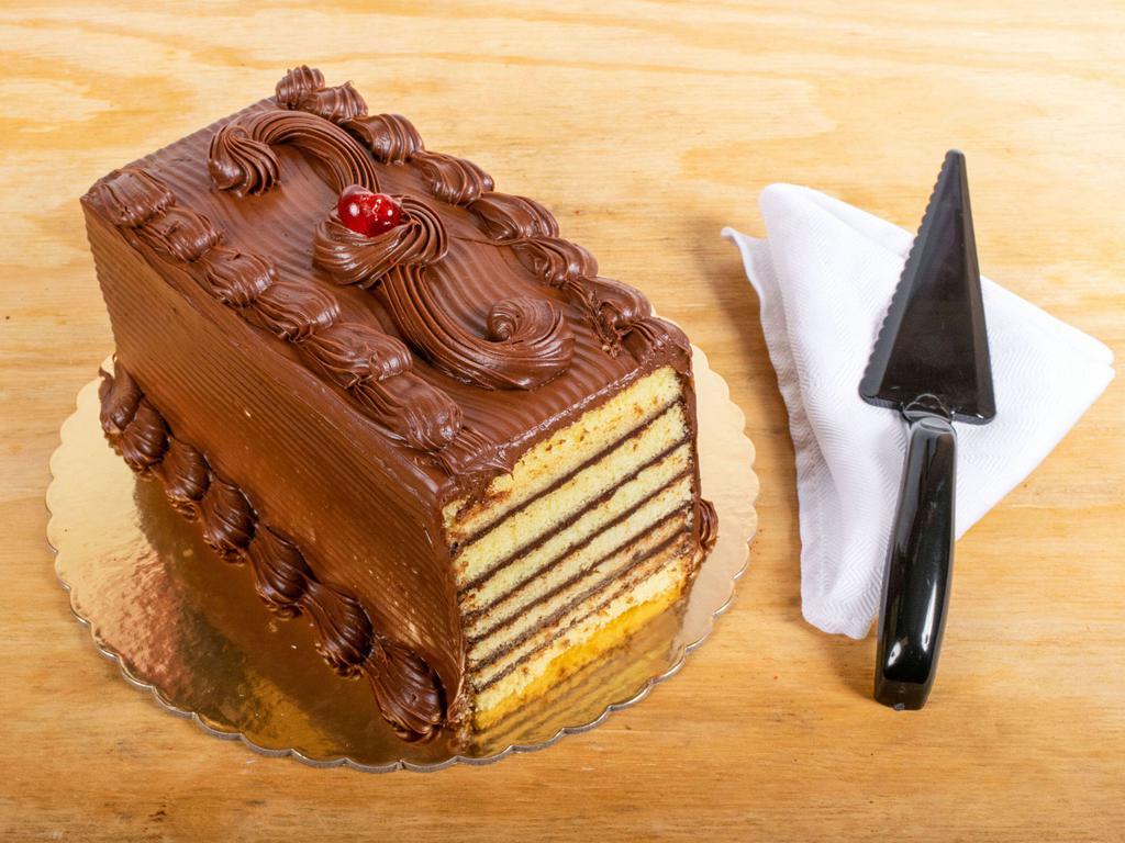 4. Seven Layer Cake · 7 layers of vanilla cake filled with bittersweet chocolate pudding and iced with chocolate fudge.