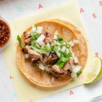 POLLO ASADO TACO · Fire grilled marinated Chicken. Served on authentically nixtamalized corn tortillas with cil...