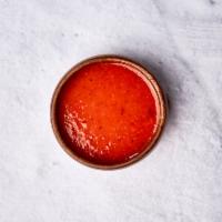 Habanero Hot Sauce · House-made hot sauce with spicy habaneros. 