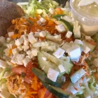 Kickin' Chicken Salad · Spicy hot chicken breast, carrots, cucumber, tomato & cheddar on a bed of lettuce served wit...