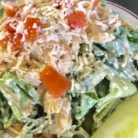 Julie's Caesar Salad · Romaine lettuce tossed in Caesar dressing with Asiago cheese, tomato, green pepper and pesto...