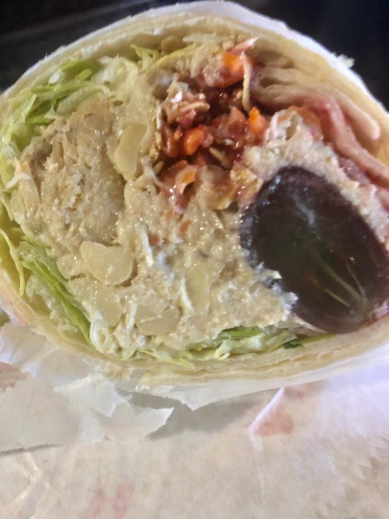Ninja Bomb Wrap · A wrap filled with Chinese chicken, lettuce, shredded carrots, granola, sunflower seeds and raspberry vinaigrette. Served with skillet potatoes & veggie medley.