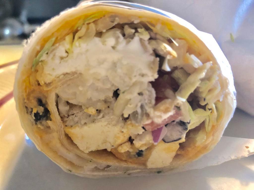 Phat Veggie Wrap · Hummus, lettuce, brown rice, black beans, tomato, goat cheese, goat cheese,  tofu and sunflower seeds. Served with skillet potatoes & veggie medley. 