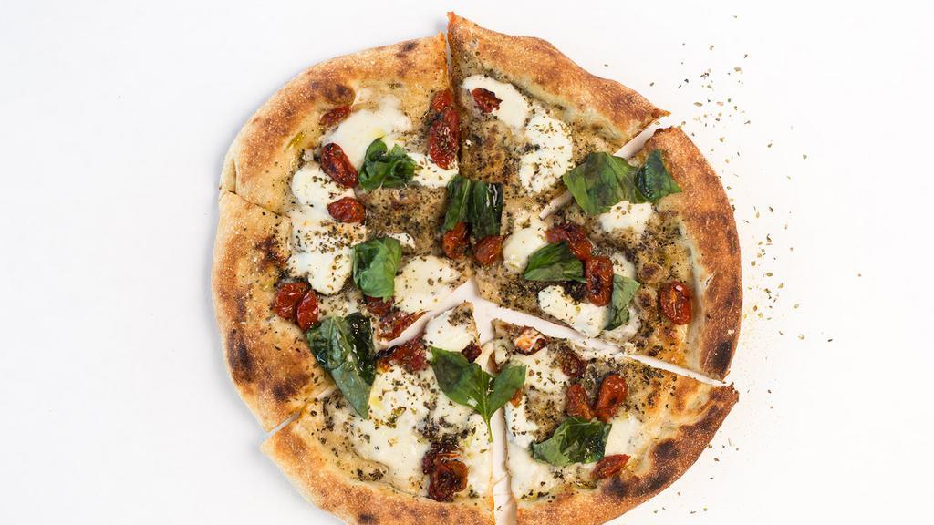9. Caprese Pizza · Olive oil, garlic, pi sprinkle, fresh mozzarella, ricotta, semi-dried tomato, fresh basil, oregano.