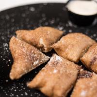  Dessert Dough · Lightly cooked, doughy. Cinnamon sugar and confectionary sugar. Inside free Nutella dip or v...