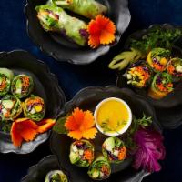 Avocado Mango Roll · 12 pieces. Organic spring mix, fresh ginger, carrots, red cabbage, cucumber, cilantro, wrapp...