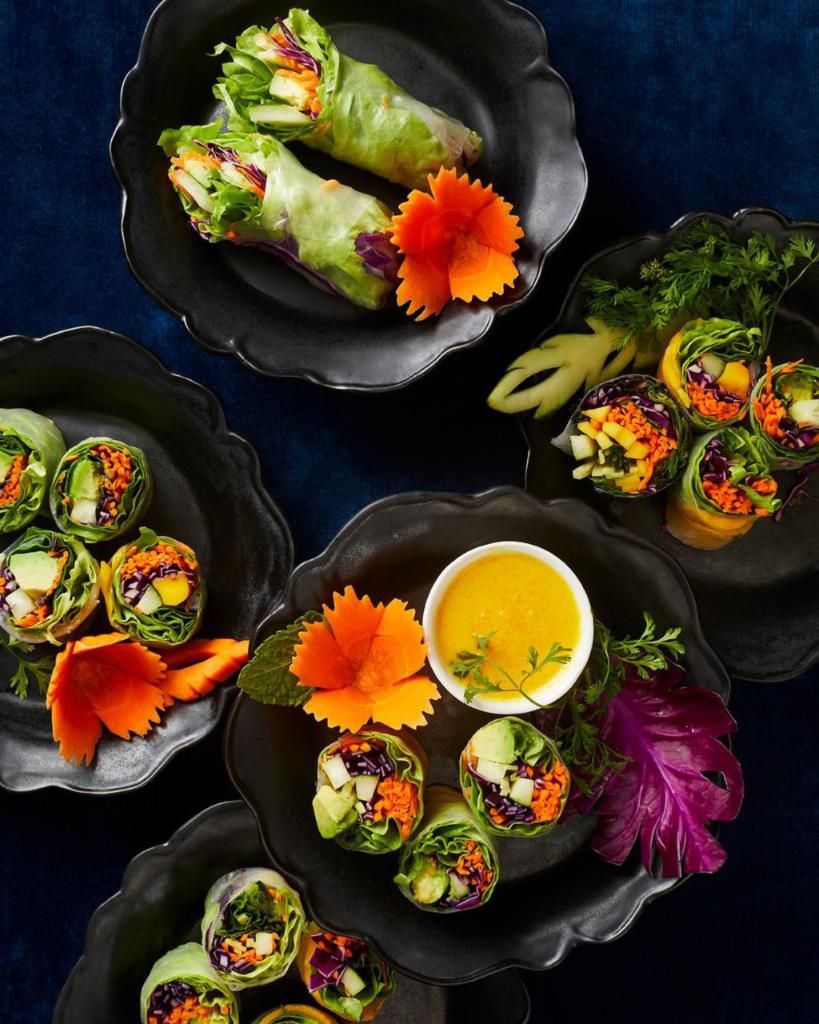 Avocado Mango Roll · 12 pieces. Organic spring mix, fresh ginger, carrots, red cabbage, cucumber, cilantro, wrapped in rice wrapper. Served with peanut sauce.