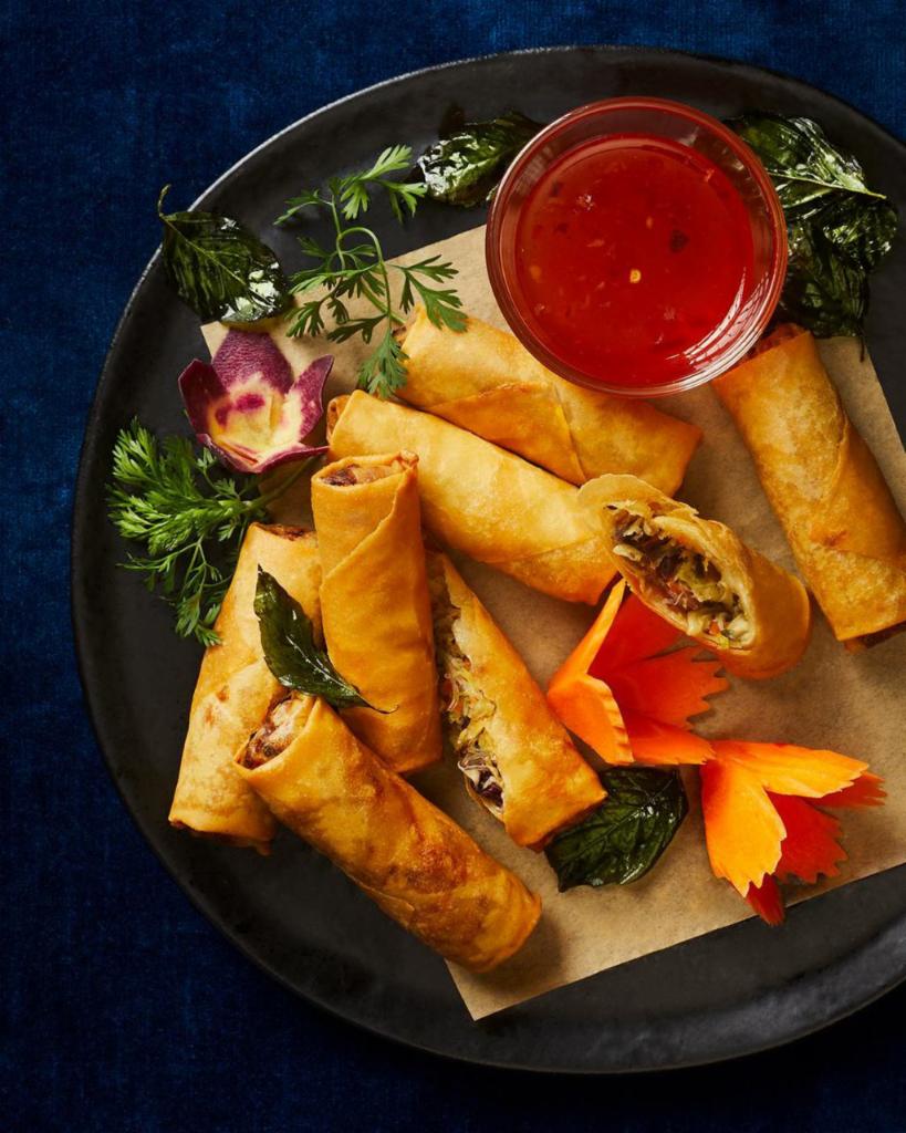 Crispy Spring Roll · Crispy wonton wrapped glass noodles, cabbage, Okinawa potato, carrots, shiitake mushrooms, ginger, fresh cilantro, fried served with our special sweet and sassy sauce.