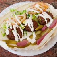 Falafel Sandwich · Served in pita bread with pickles, lettuce, tomatoes, onions and hummus.