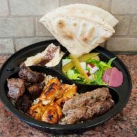Al Nour Platter · 1Beef kabab,1chicken kabab,1kofta kabab 
Served with rice, salad, hummus, with tahini sauce ...