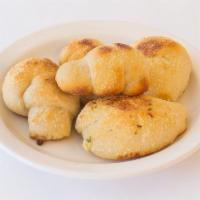 Garlic Knots · 5 pieces. Jumbo knots hand tied and baked with garlic.